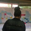 Woman looks at maps of Pasadena