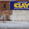 Image of election sign on brick wall for Mayor Clay in Indiana