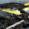 Image of large pothole on a road