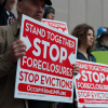 Protestors at a rally demanding accountability from Wall Street