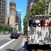 FedEx truck pulled to side of city street