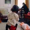 child at home with working mother