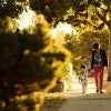 Woman and child walking in neighborhood