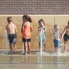 Children playing in fountains