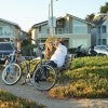 Man and woman on bench by bikes