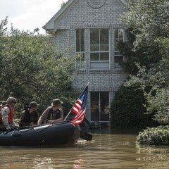 Rescue team at a flooded house during Hurricane Harvey