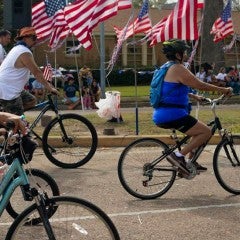 Families on bikes at a July Fourth parade in Houston's Northside neighborhood. Jimmy Castillo, CC BY-ND