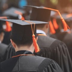 Students attend a graduation ceremony