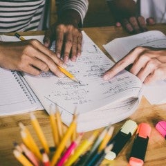 Students review coursework during a class session.
