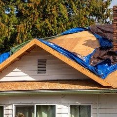 photo of a house undergoing roof repair
