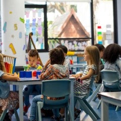 Elementary school students attend a class together.