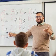 teacher in classroom teaching ABC
