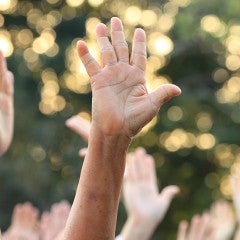 people participating by raising thier hands