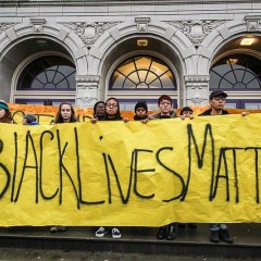 Photo of young people holding a "Black Lives Matter" sign