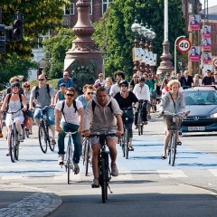Copenhagen residents bicycle through the city. Image via flickr/Colville-Andersen.