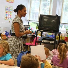 Teacher speaking to a classroom full of students