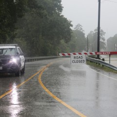 Police car blocking road due to high water