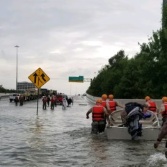 People wade through flood waters during Hurricane Harvey.