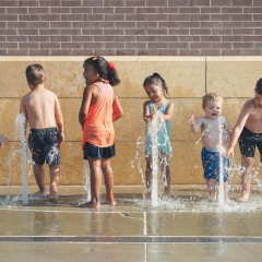 Children playing in fountains