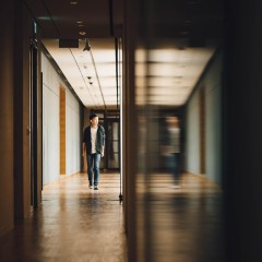 Student walking in school hallway 